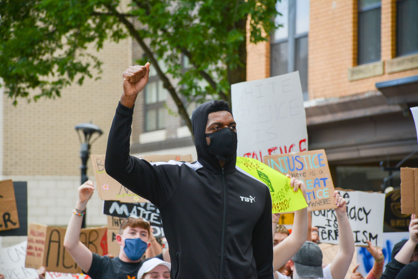 Jun. 2, 2020 - Former WVU basketball player John Flowers holds up his fist during the protests in downtown Morgantown.